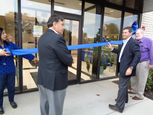 Martin Mitchell and Steven Mitchell cutting the ribbon to open Certified Laboratories’ Melville, N.Y. lab location. 