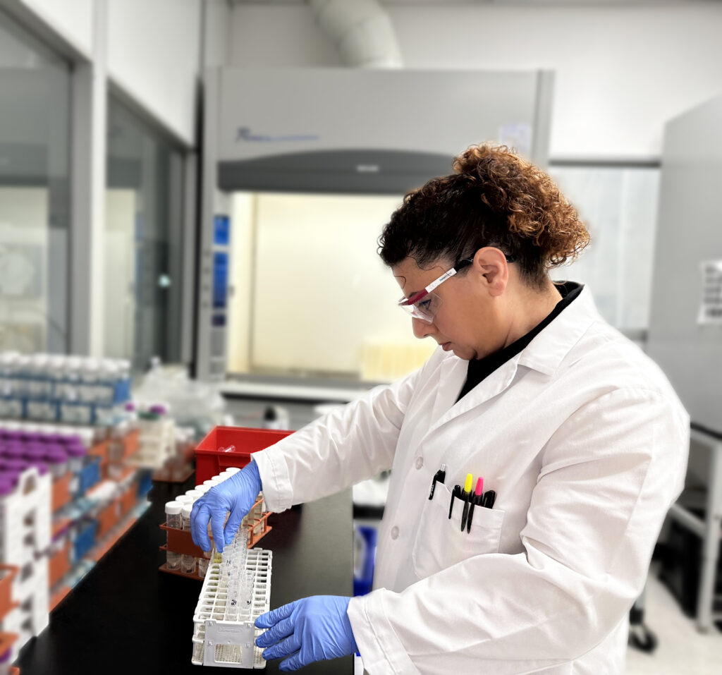 Scientist preparing cosmetic samples for heavy metals lab testing. 