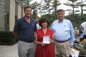 Martin and Steven Mitchell with a Certified Laboratories employee on her retirement. 