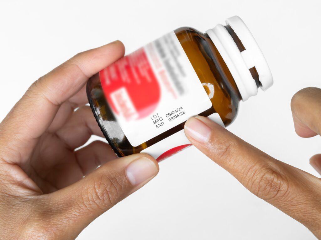 ExpireDrugsCheckFingerWomanPointingMfgAndExpDate - Certified Laboratories Natural Health Products (NHP) must contain an expiry date on the label backed by stability testing.